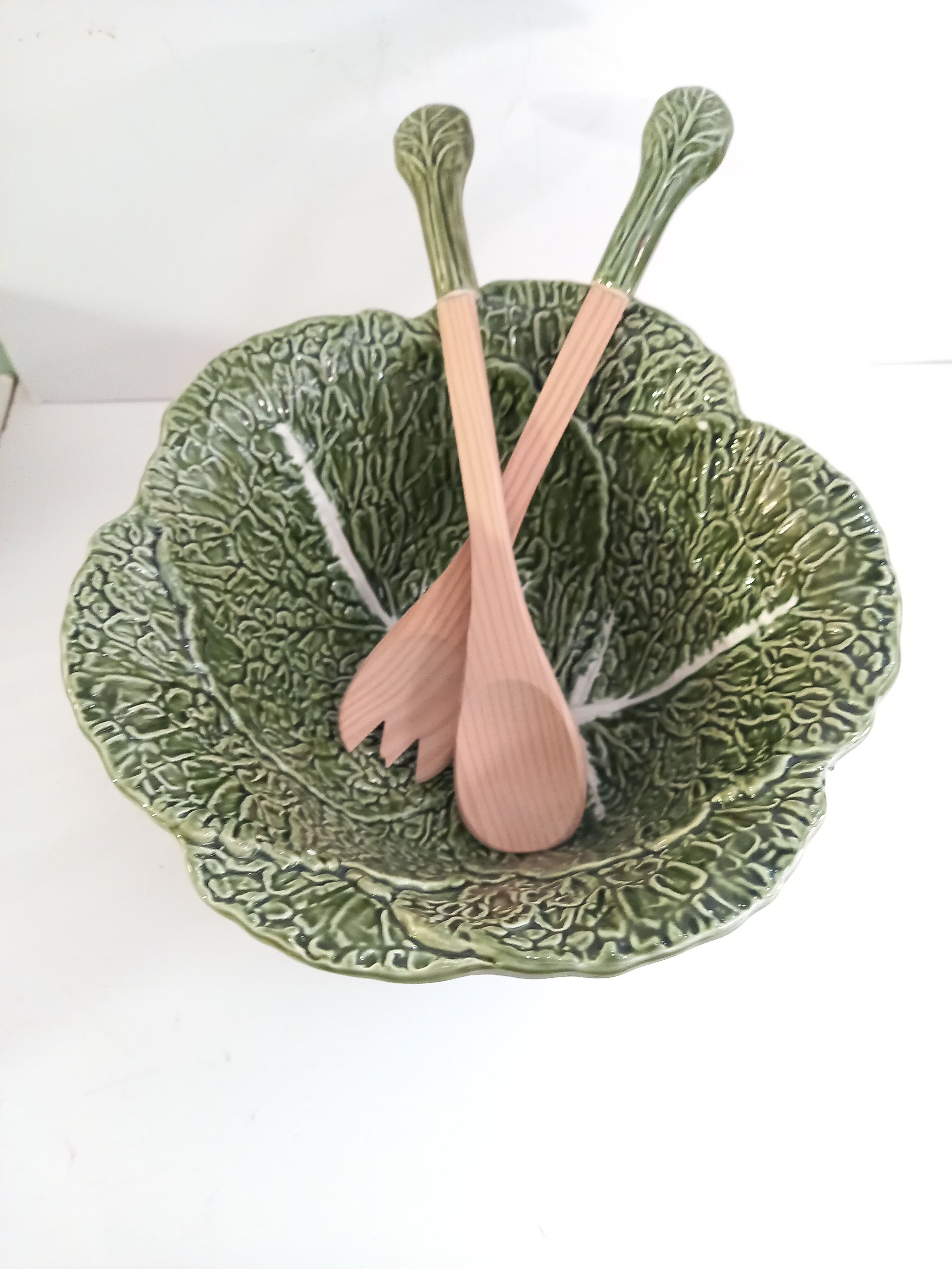 Vintage salad bowl in dabbling cabbage leaf and cutlery