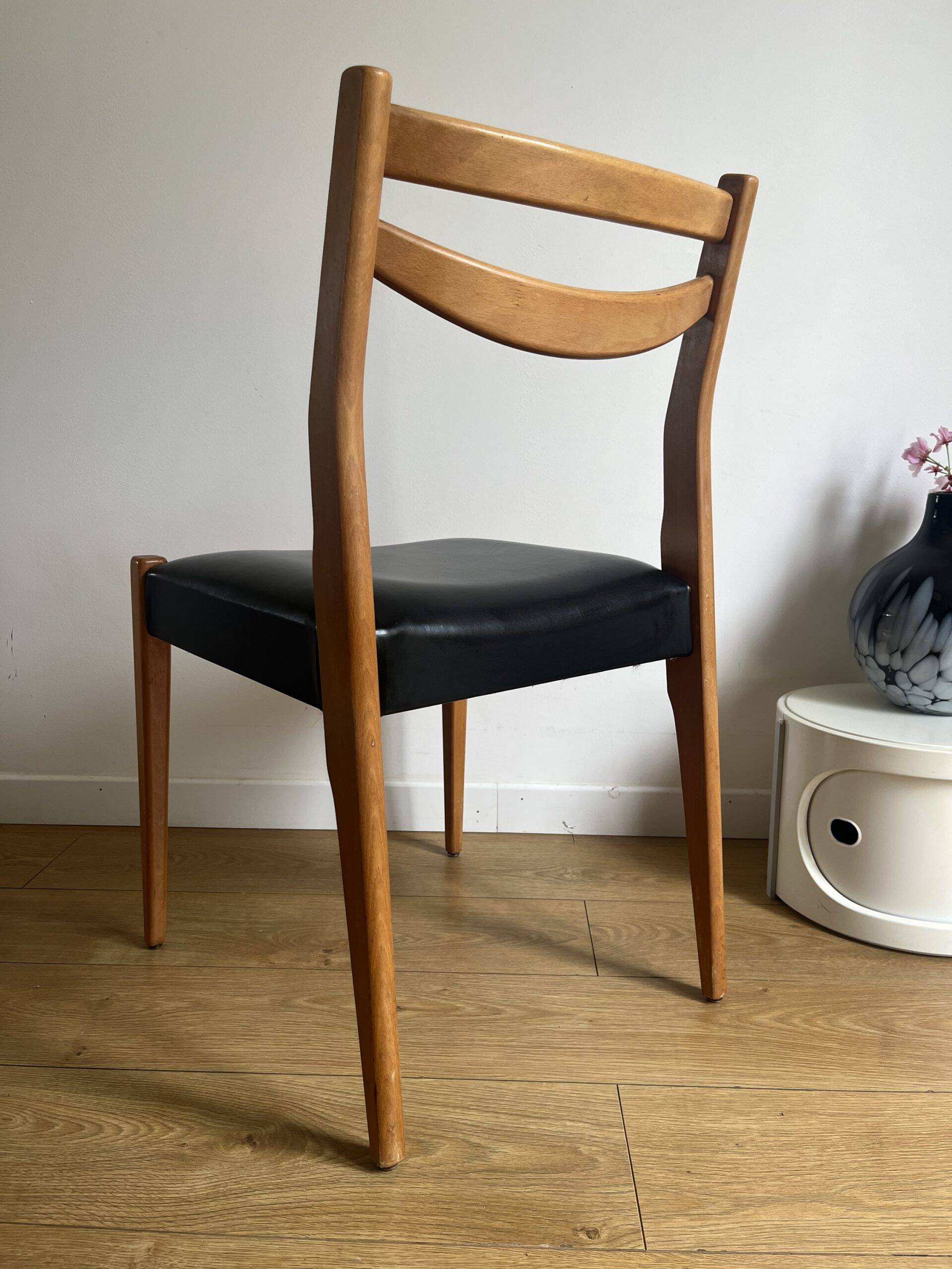 Vintage chair in wood and black leatherette