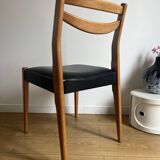 Vintage chair in wood and black leatherette
