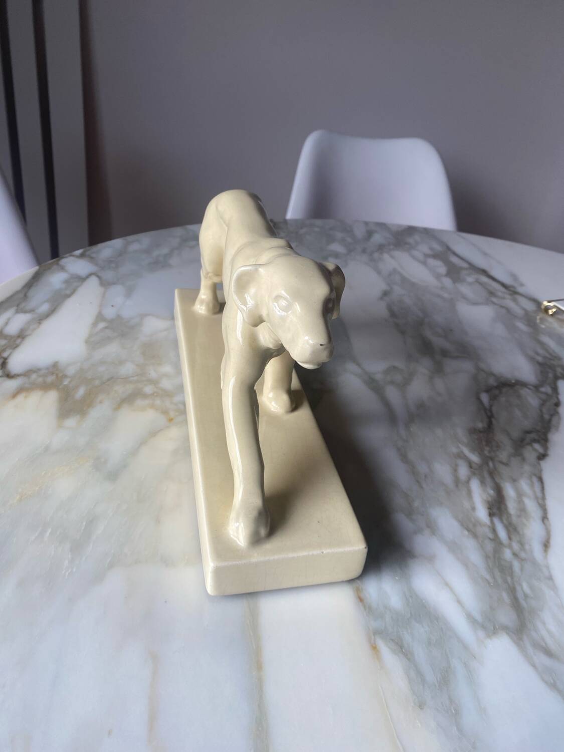 Ceramic of a walking dog brand Odyv