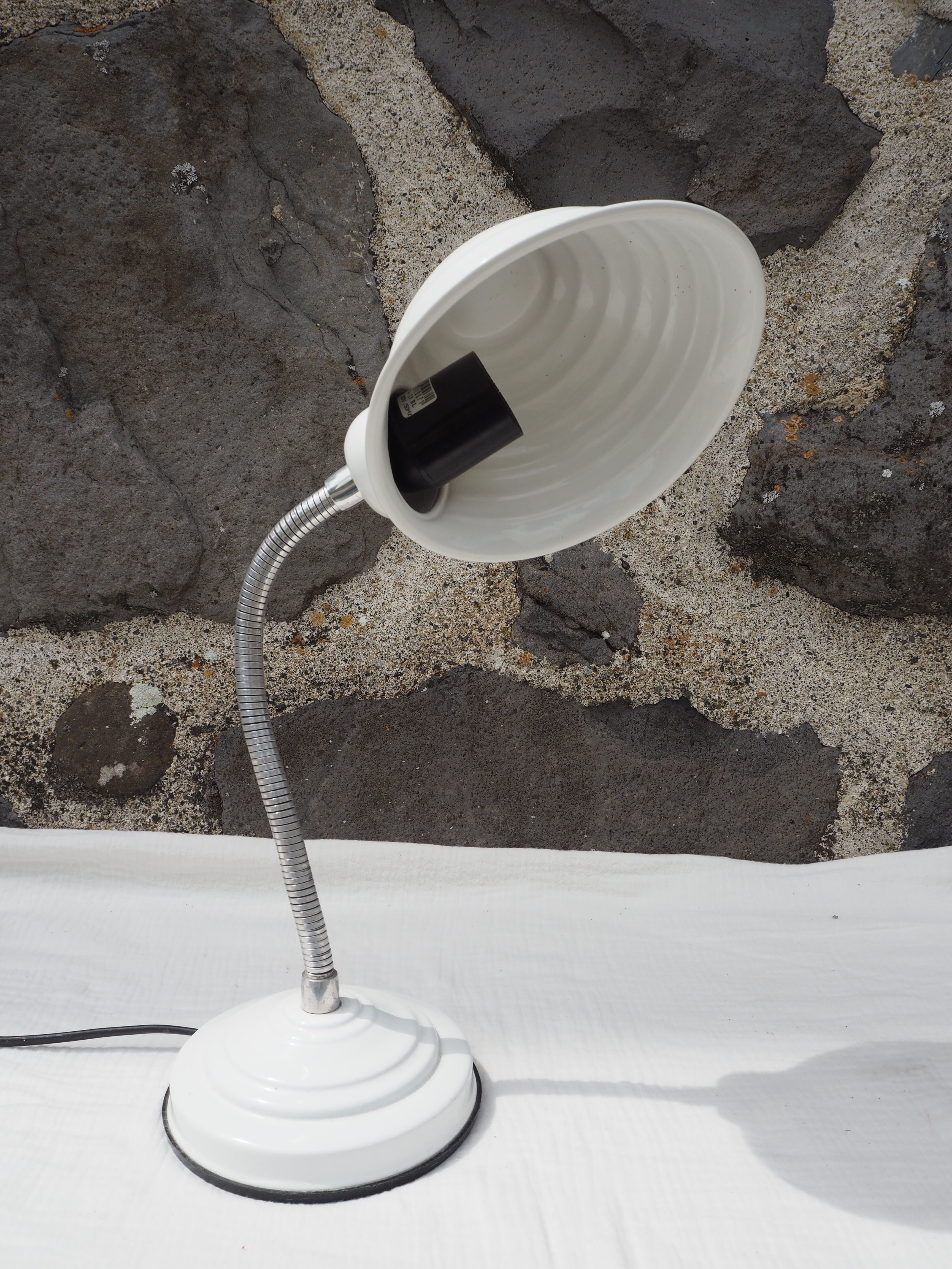 White articulated lamp with metal arm