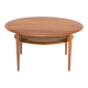Table basse ronde en teck et en rotin par Peter Hvidt et Orla Mølgaard Nielsen pour France & Søn, années 1960.