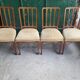Serie de 4 chaises directoire en marqueterie et merisier