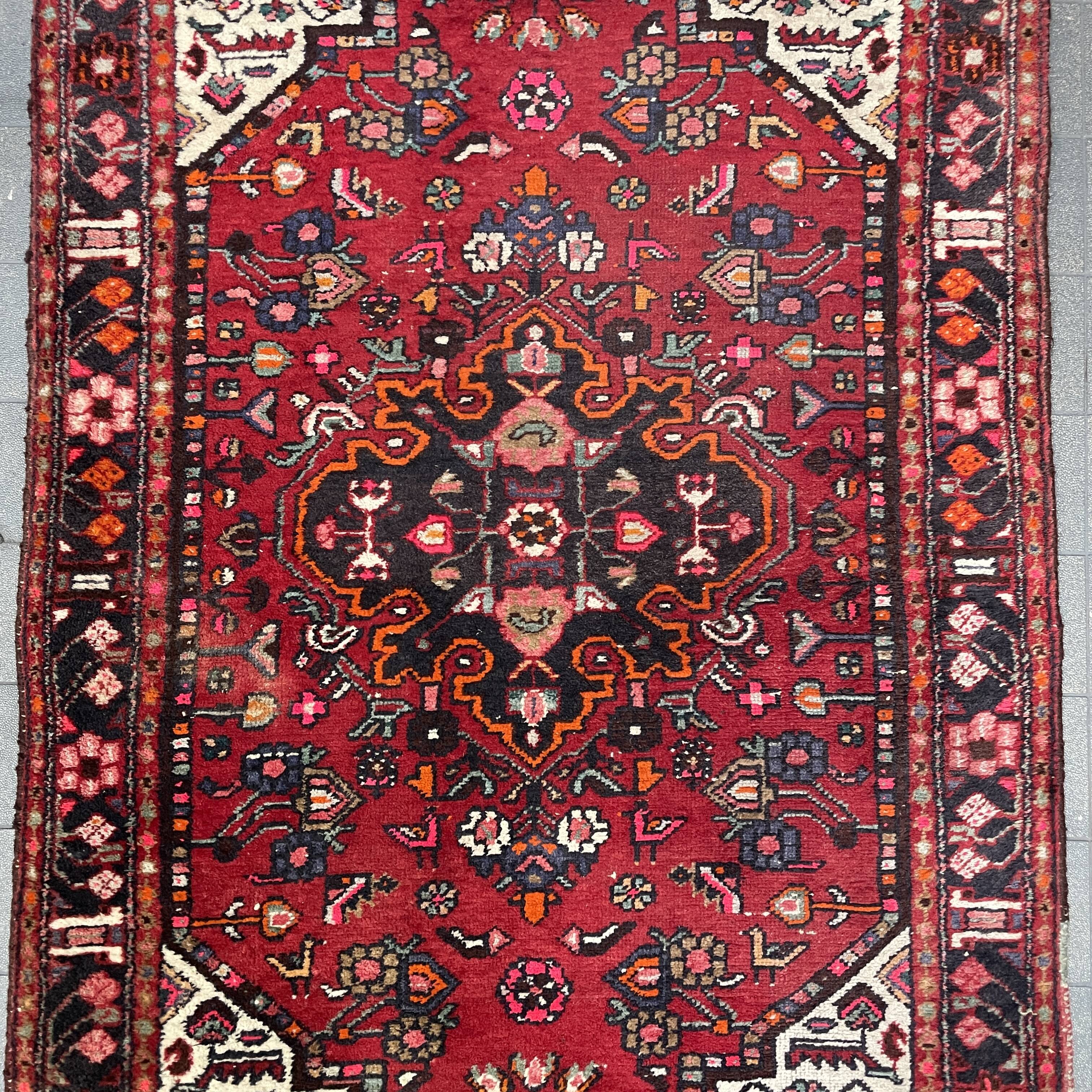 Worn vintage oriental rug or carpet