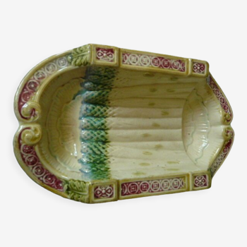 Old asparagus dish in saline slip fixed cradle