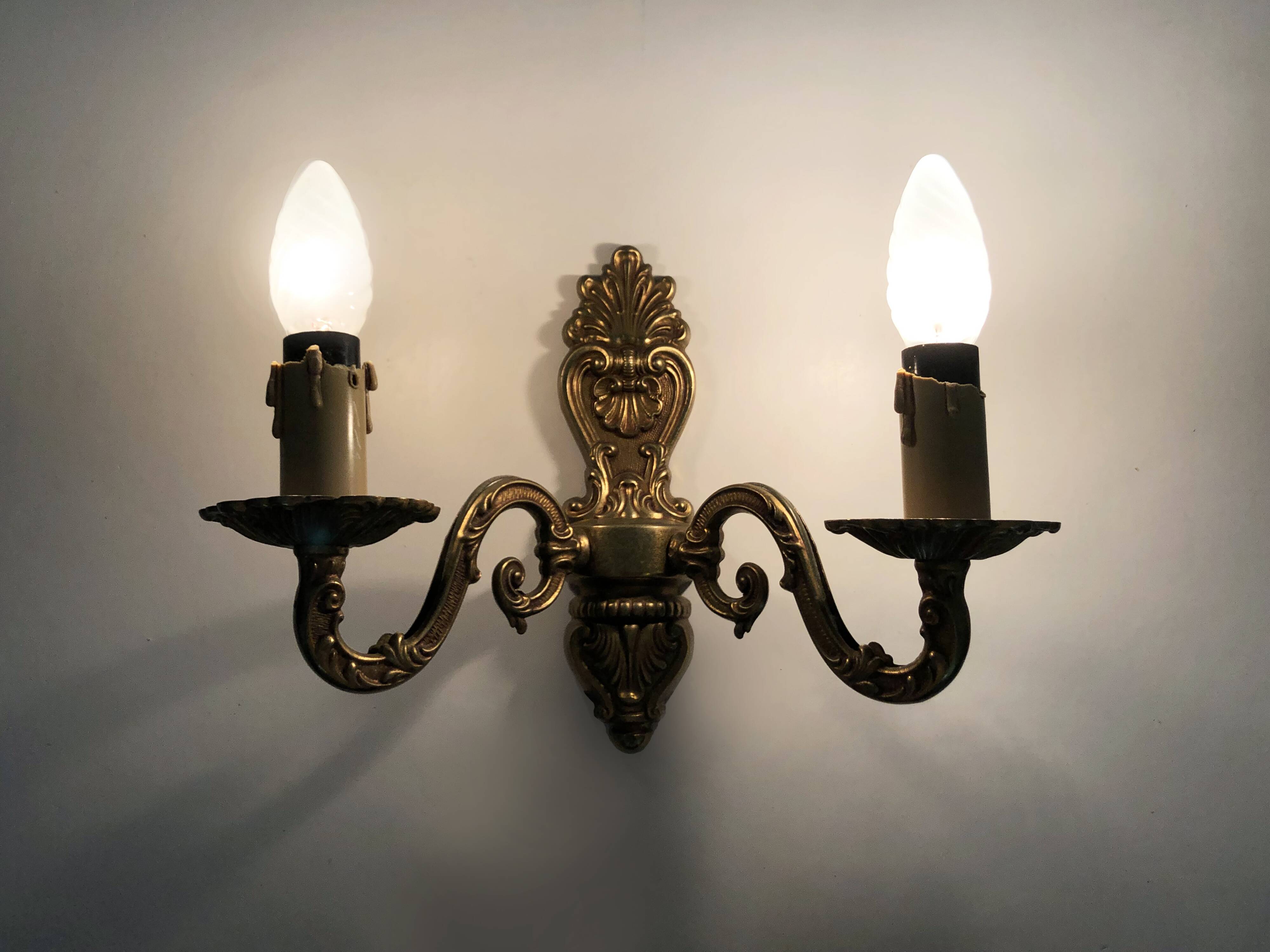 Old pair of double-light brass wall sconces. 60s