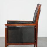Black cowhide leather and wooden Art Deco design armchair