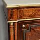 Elegant Napoleon III style commode with fine marquetry, gilded bronze mounts, and a marble top.