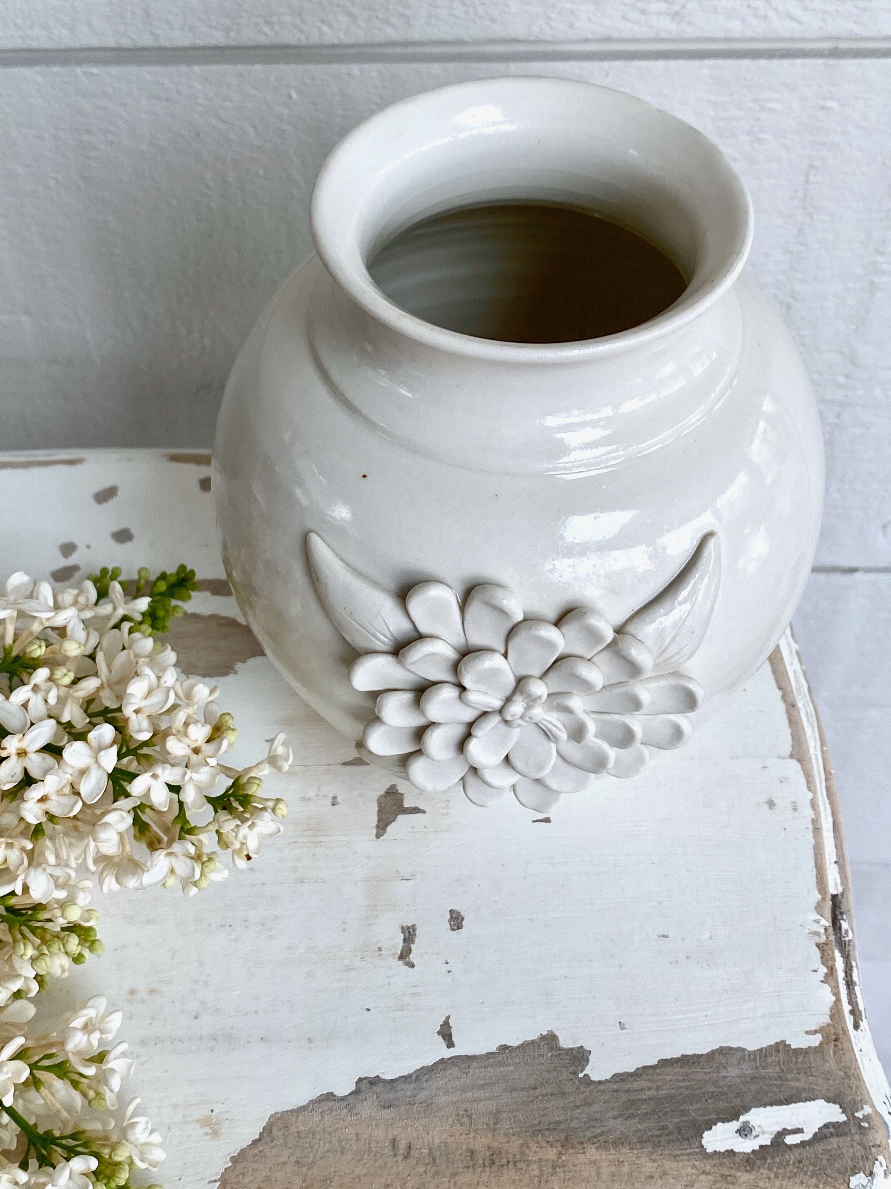 Small ceramic vase with floral relief