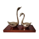 Duo of brass swans on base