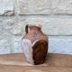 Old small pitcher in glazed terracotta