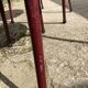 Metallic burgundy bistro chair for restaurants and communities with gray fabric