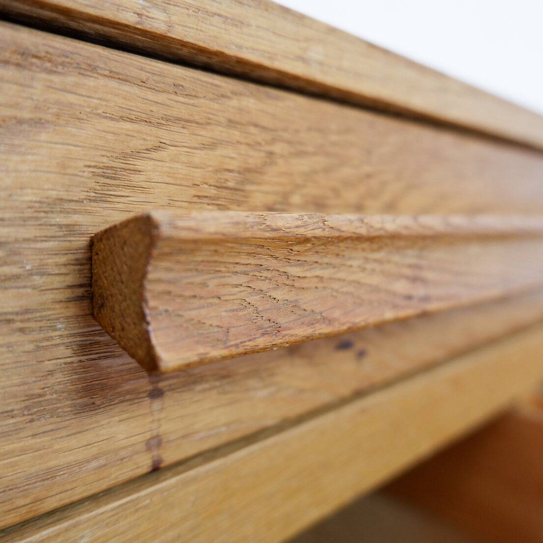 1960s wooden sewing cabinet with double-sided drawers
