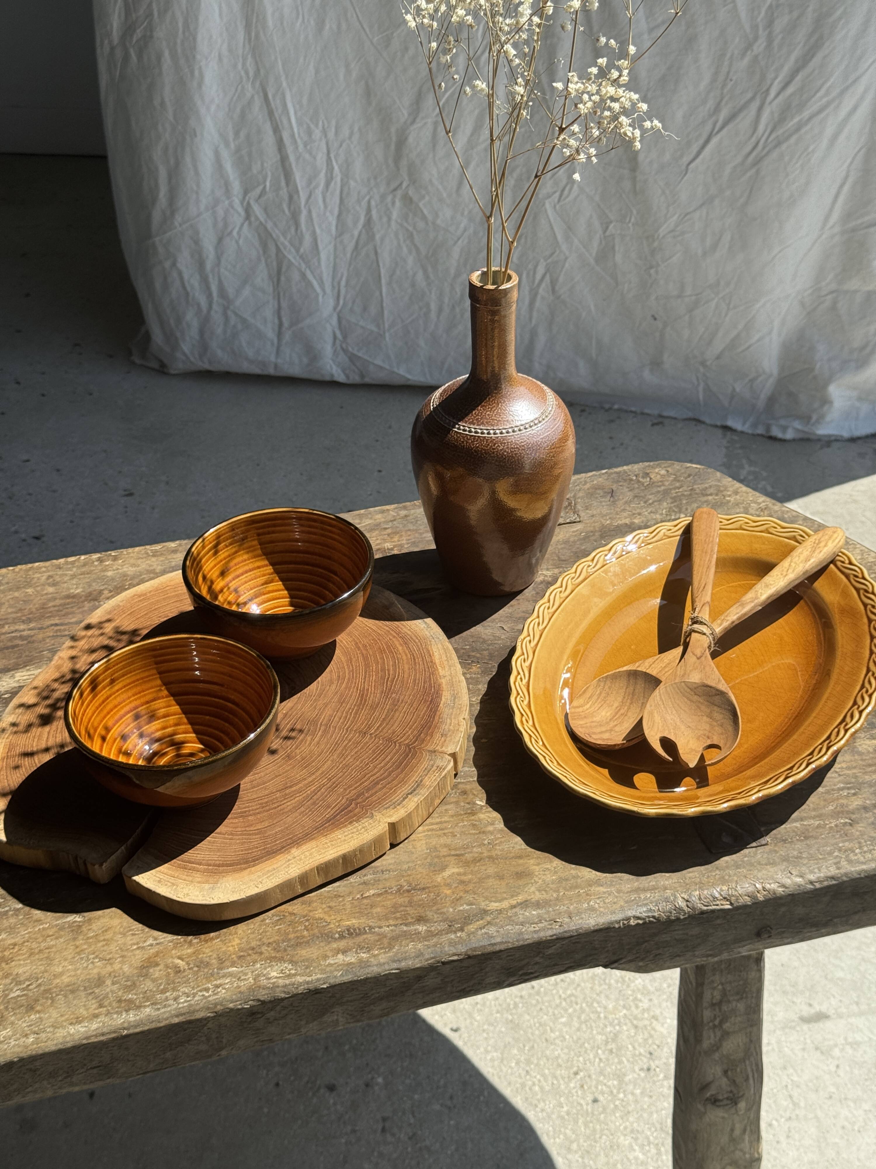 Pair of small orange bowls with black edging