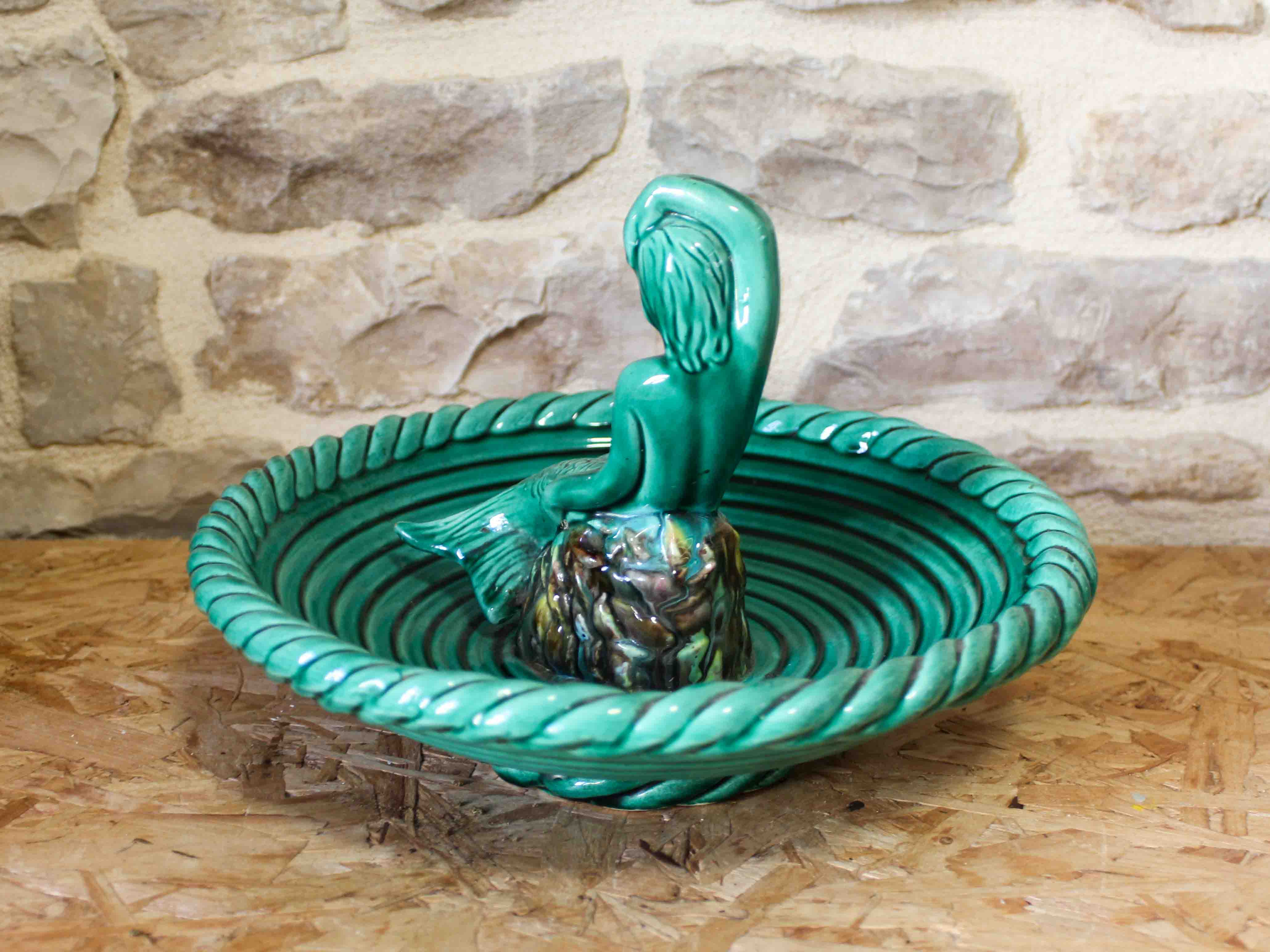 Ceramic cup with mermaid decoration