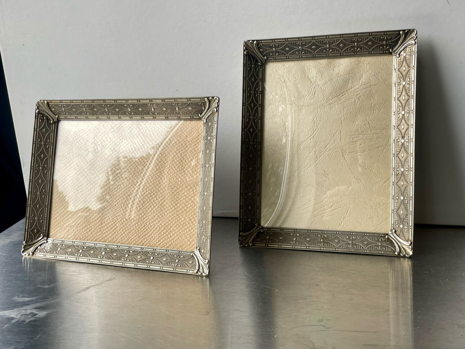 Pair identical vintage metal frames each 18.5 cm x 14.5 cm convex glass