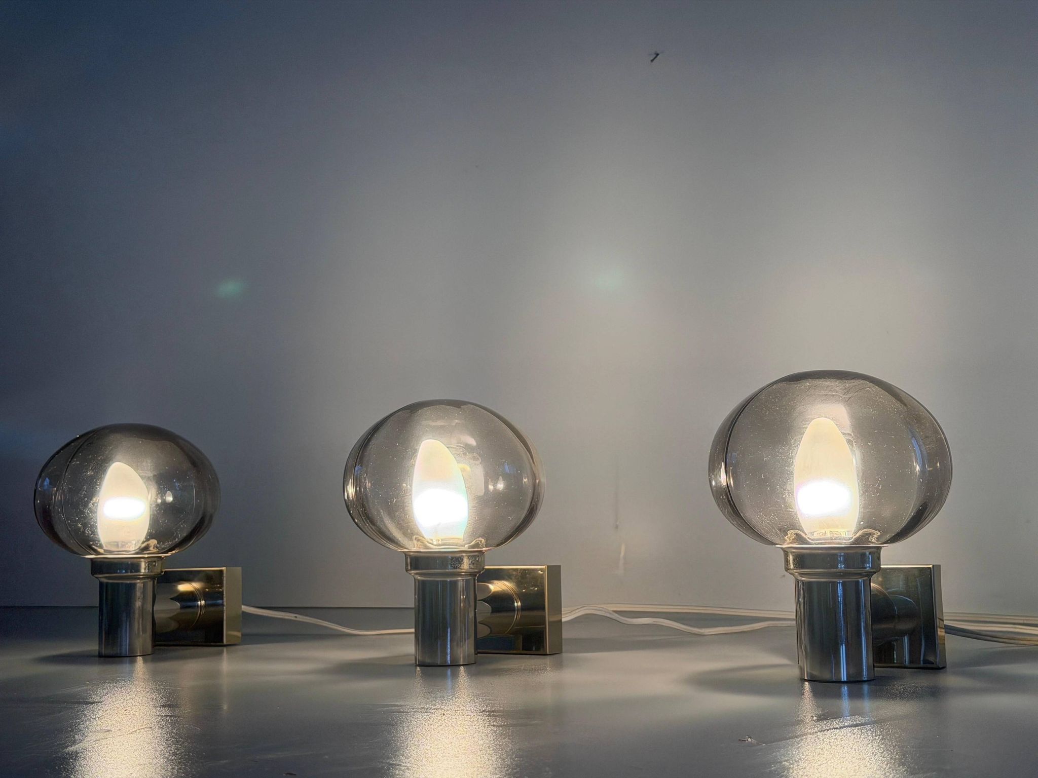Set of 3 grey glass and chrome wall lights from the mid-century by N Leuchten, 1960s, Germany.