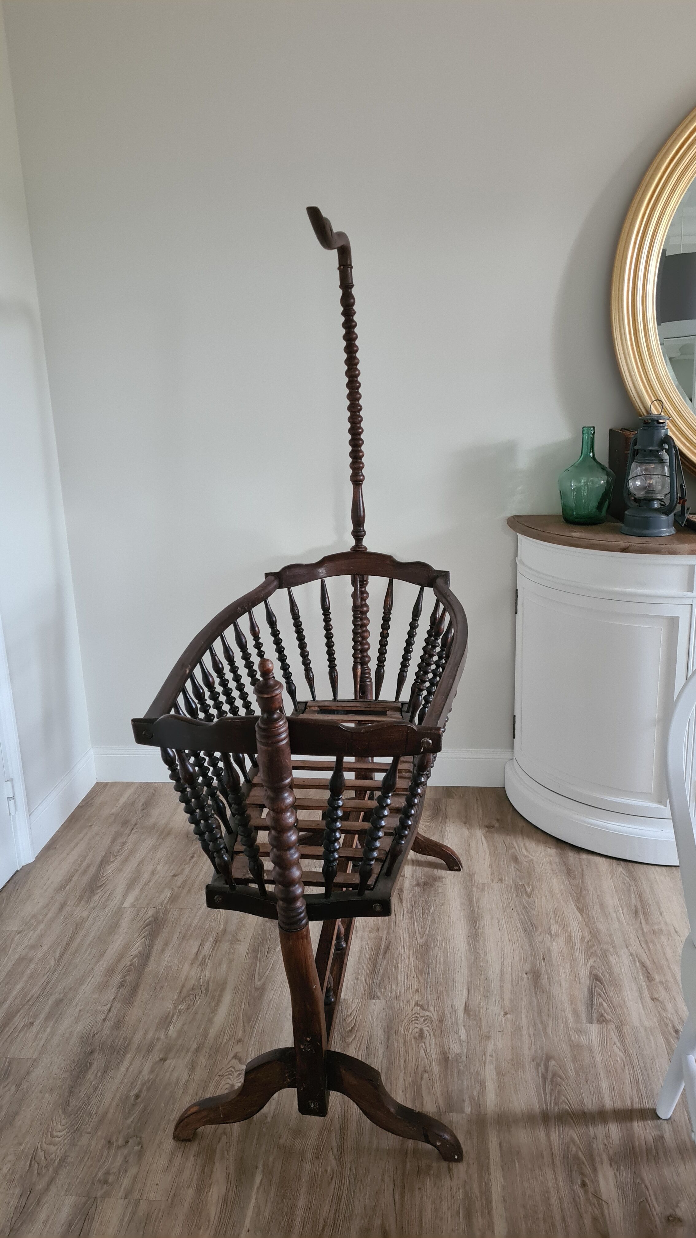 Old wooden rocking cradle twisted / vintage bars