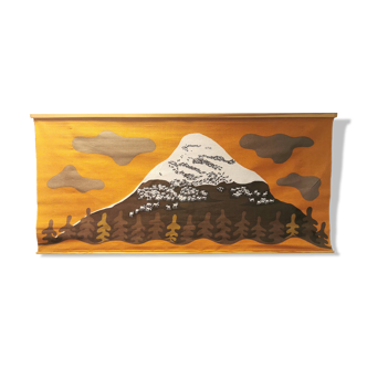 Beautiful wall-mounted Swedish fabric print with motifs of mountains, reindeer and more.