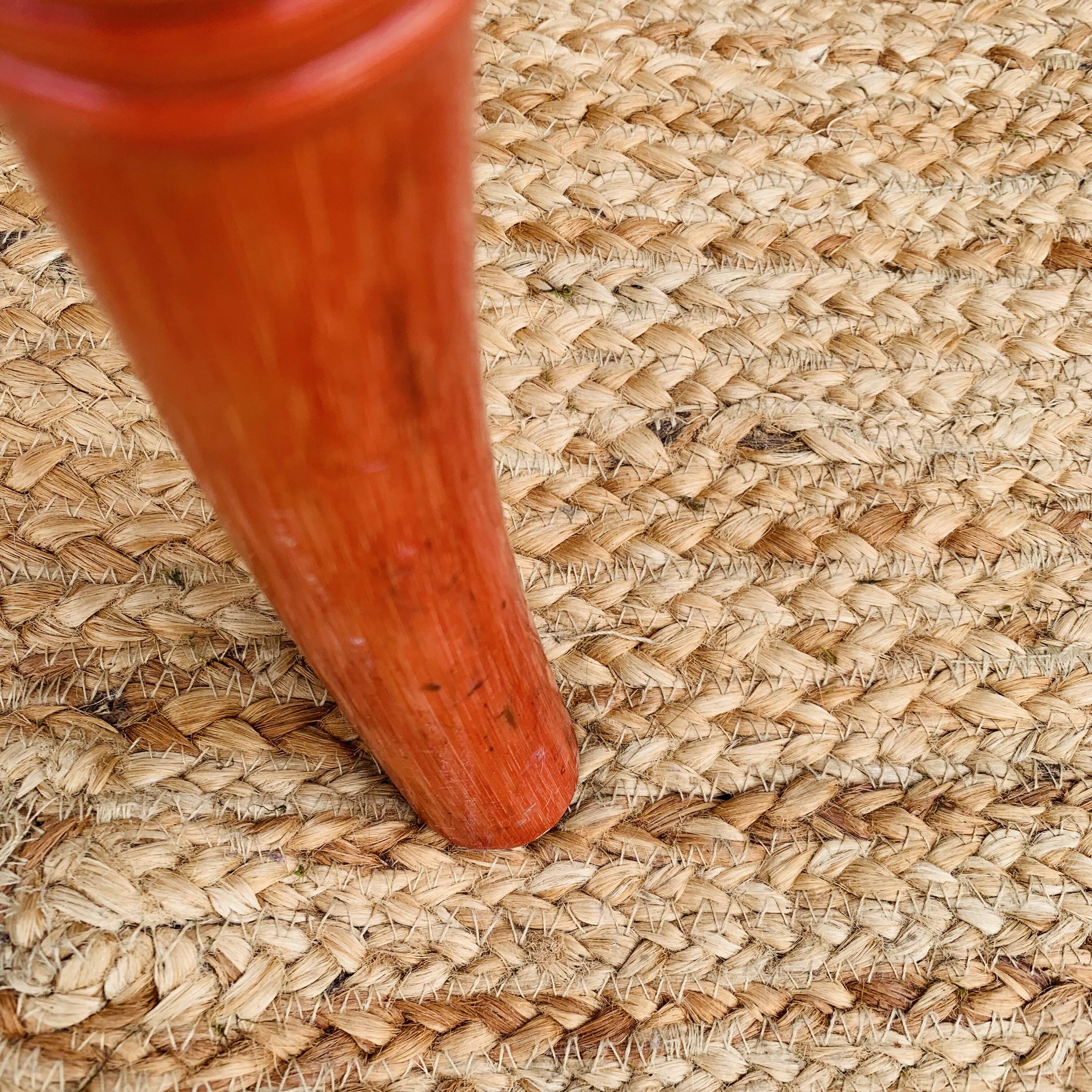 Pair of red rattan chairs and fabric