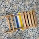 Folding chair in wood and striped fabric