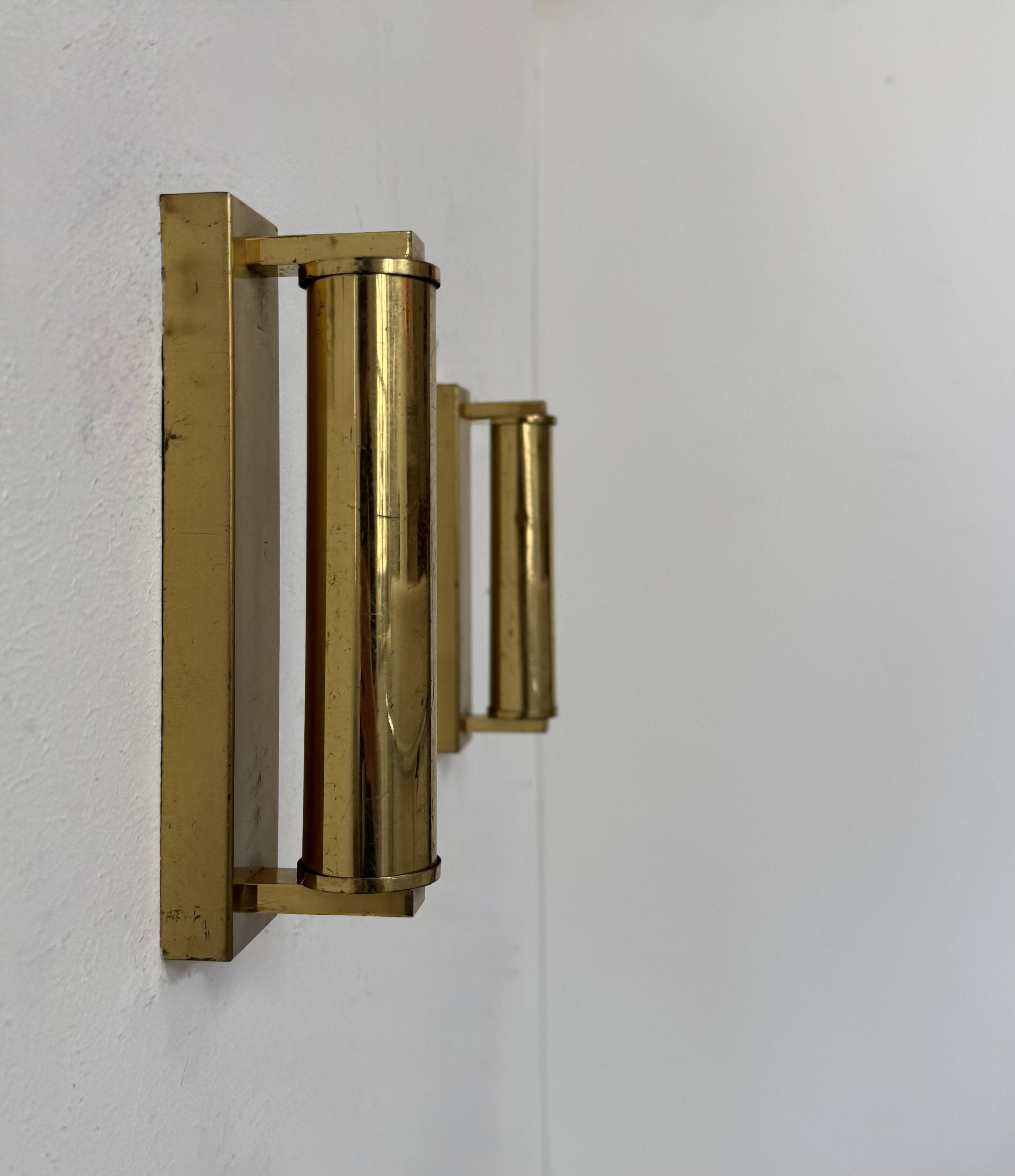Pair of vintage modernist adjustable wall lights, brass, France 1970.