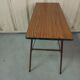 Folding table in formica brown console