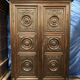 Antique Louis XIII armoire in solid walnut with carved doors