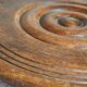 Low tripod stool in vintage turned solid wood