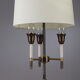 Lampe de table moderniste en métal laqué noir et doré