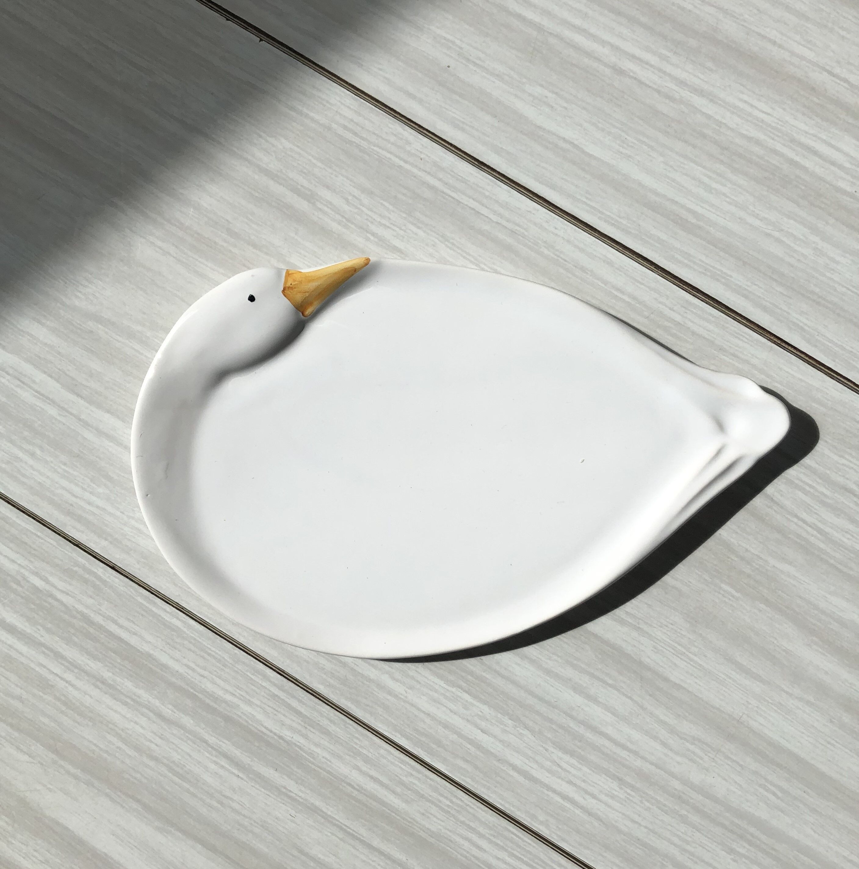 Elegant serving dish in vintage white goose ceramic. Signed DH