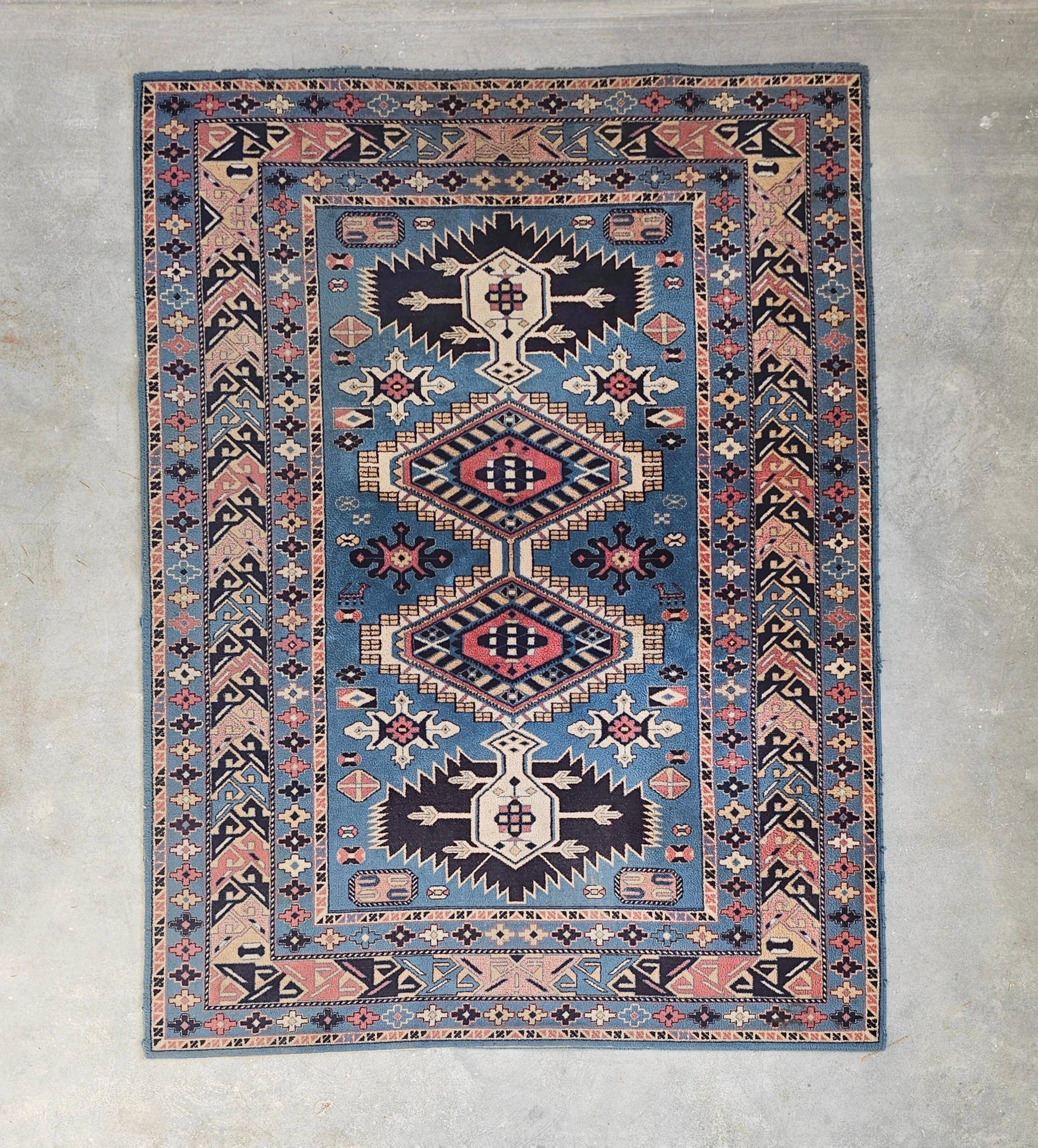 Vintage Kazak rug with geometric oriental motifs, 100% wool.