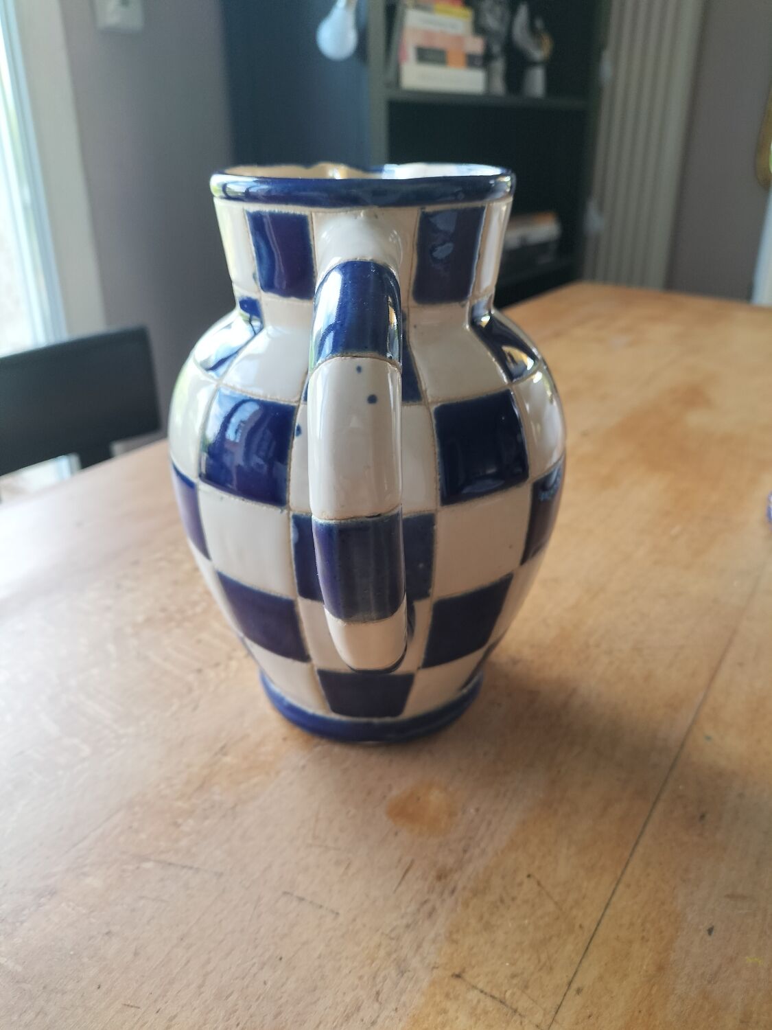 Blue and white checkerboard water pitcher