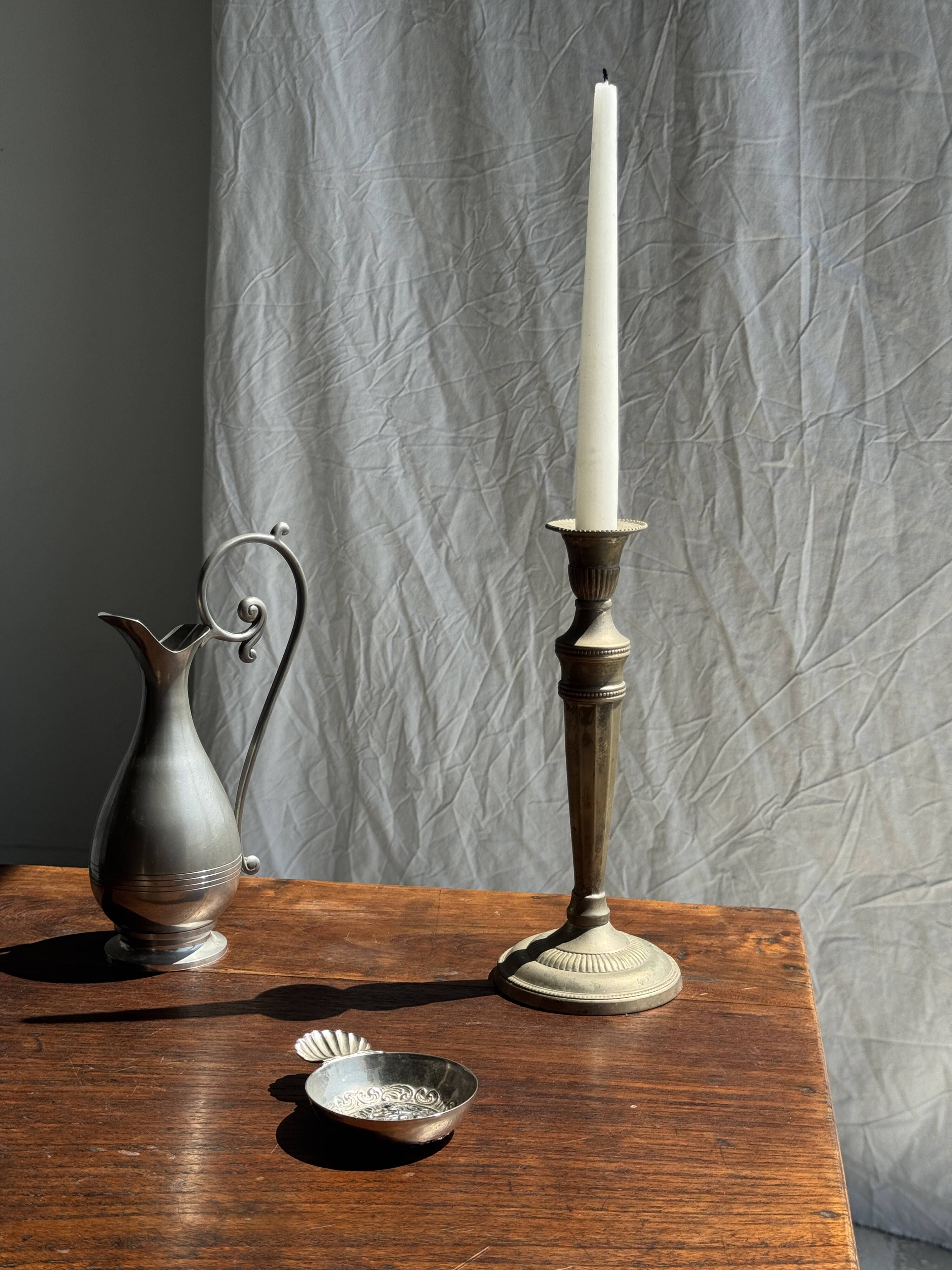 Pair of classic candlesticks in patinated gold metal H25