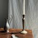 Pair of classic candlesticks in patinated gold metal H25