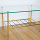 Glass coffee table with magazines holder