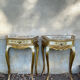 Pairs of Florentine bedside tables in gilded wood.