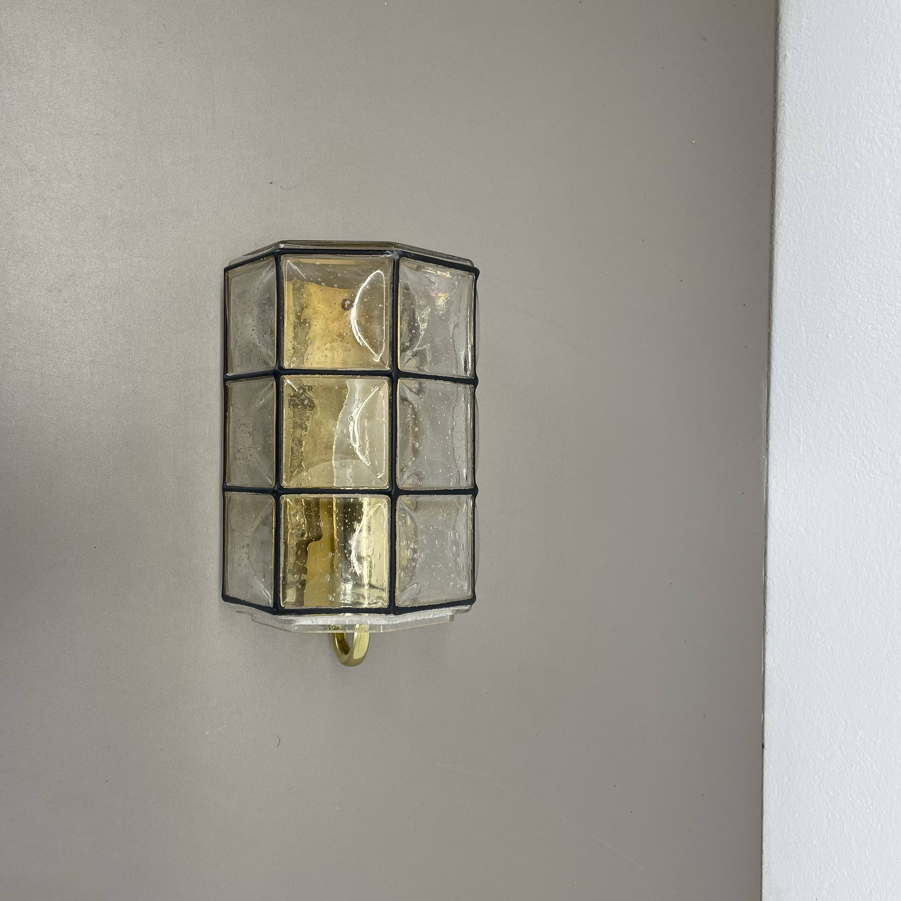 Wall light "Iron Rings" in brass and glass by Glashütte Limburg, Germany, 1970s