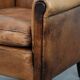 Vintage sheepskin armchair with a beautiful light colour and elegant legs