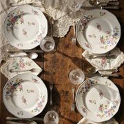 4 flat plates by Bernardaud, Limoges porcelain, floral decoration from the 1920s to 1950s.