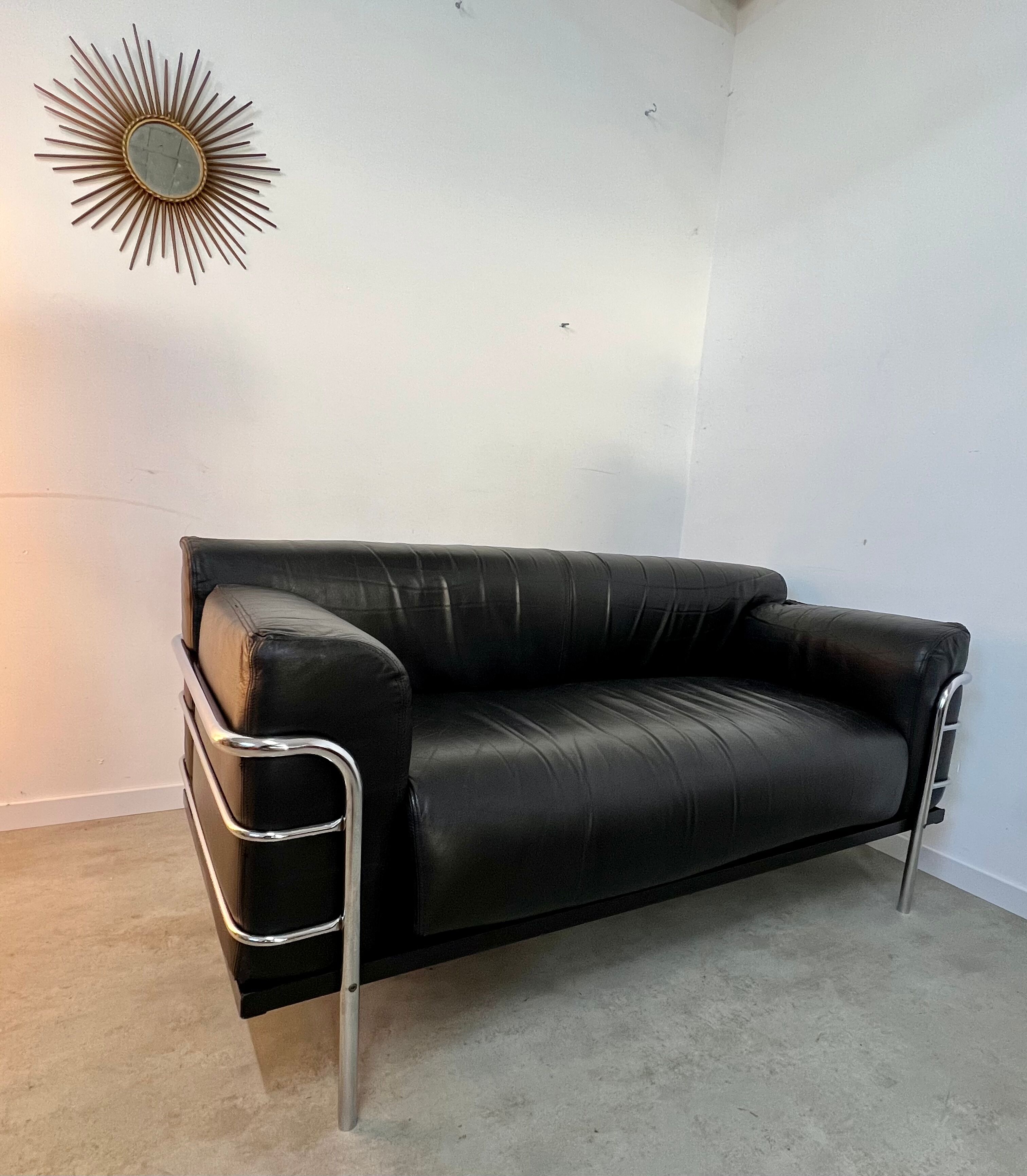 Old vintage leather and tubular metal sofa, design 70s