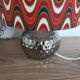 Vintage table lamp with printed shade featuring seventies waves.