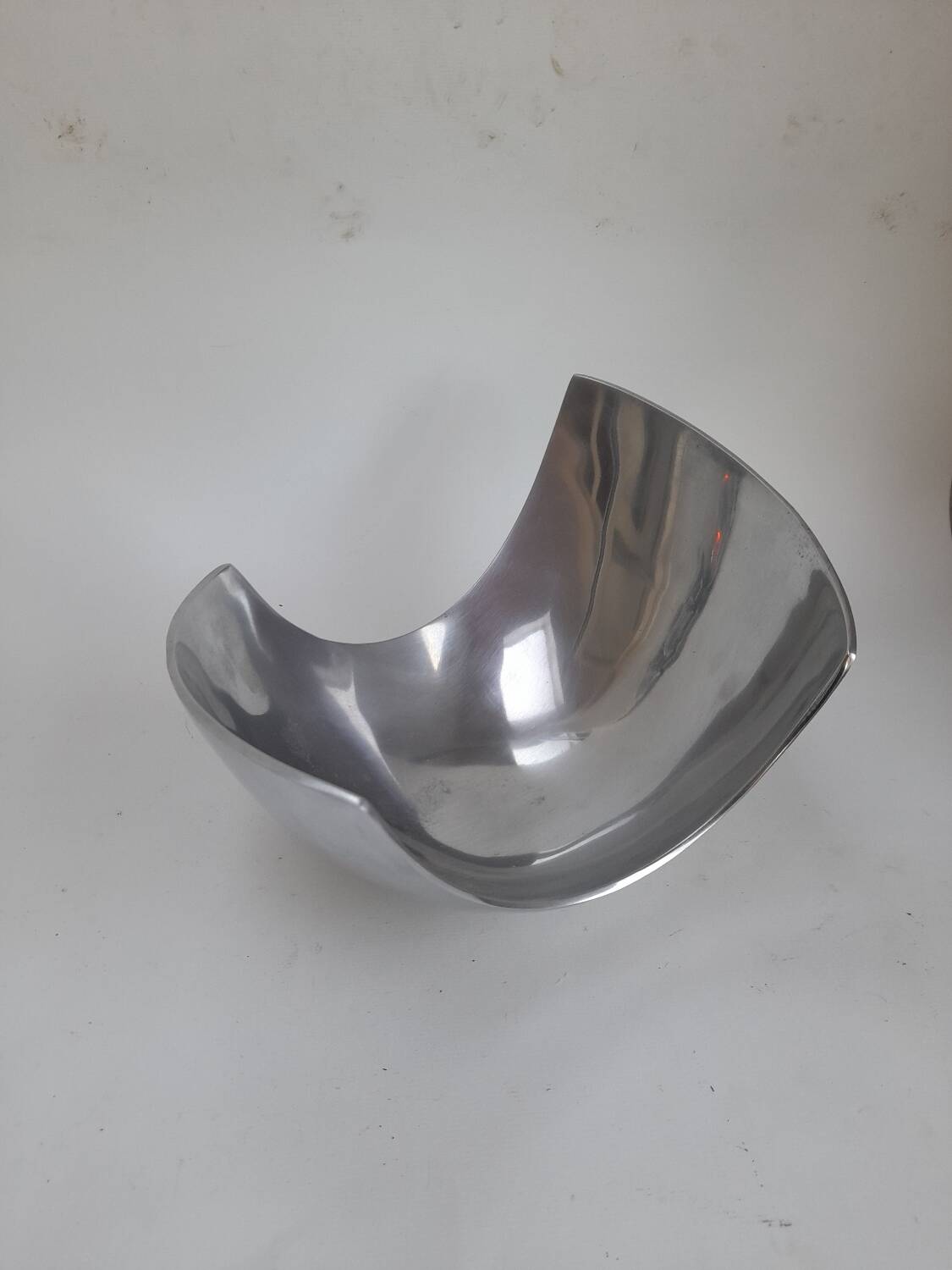 Asymmetrical aluminium fruit dish from the 90s.