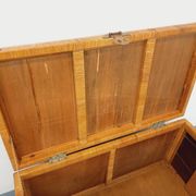 Vintage trunk in wood, rattan, caning, and brass.