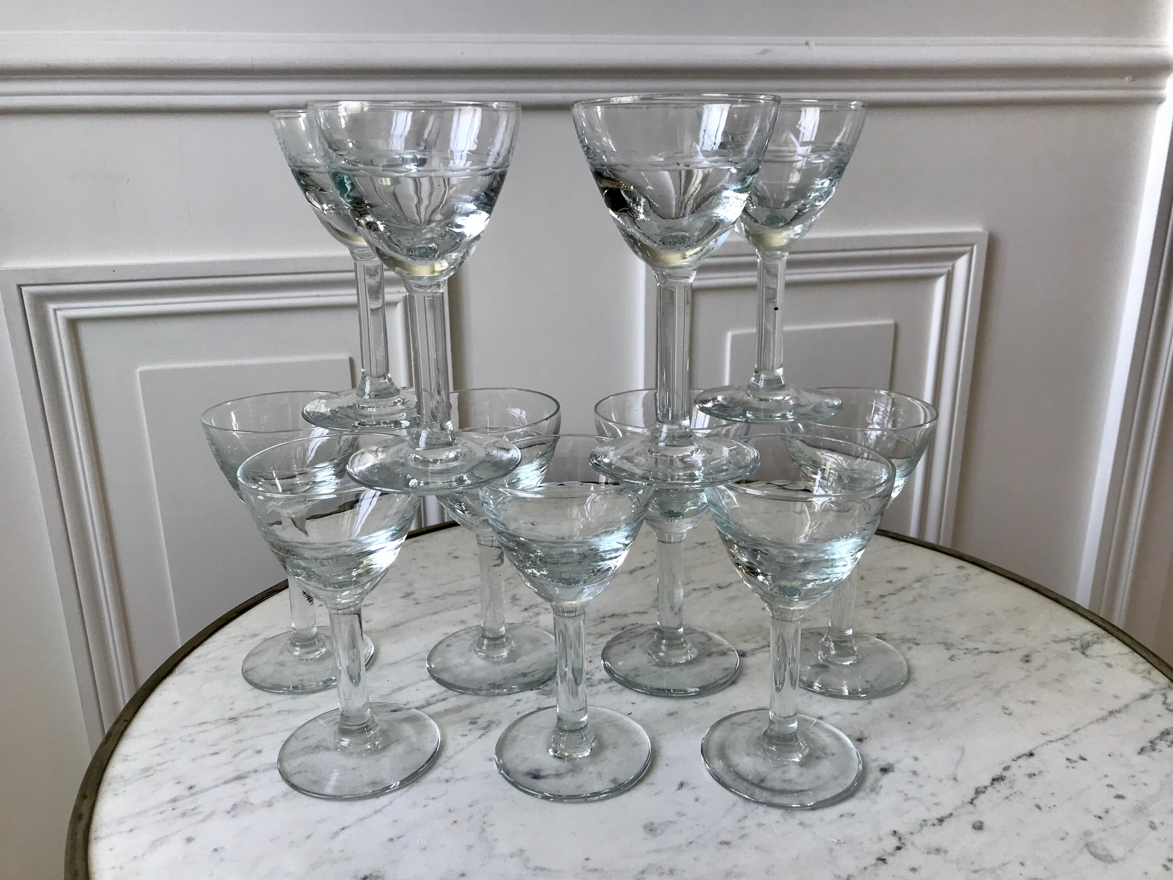 Set of 11 molded glass wine glasses engraved 20s