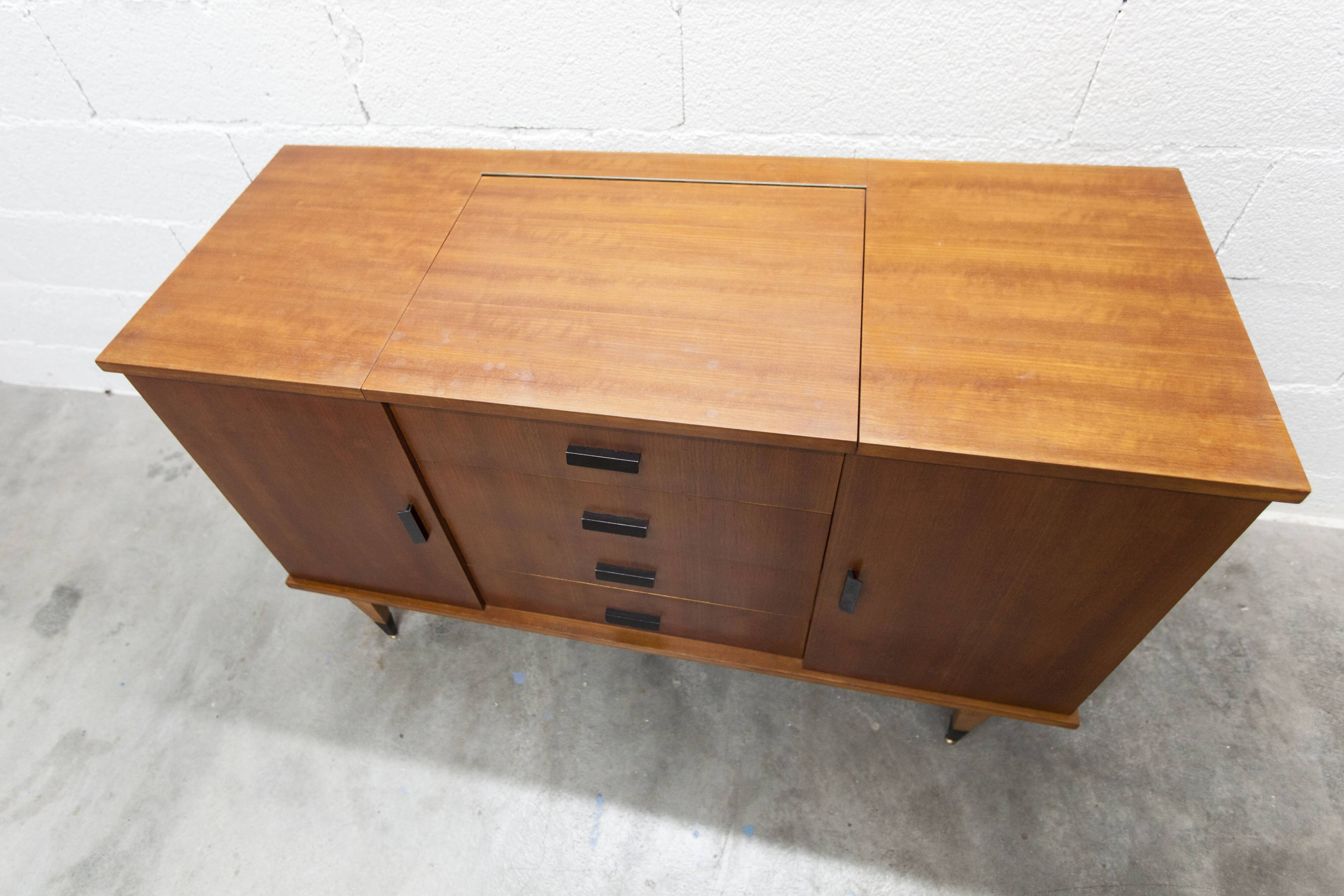 1960s teak sideboard with 4 drawers, 2 doors, and a mirror.