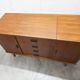 1960s teak sideboard with 4 drawers, 2 doors, and a mirror.