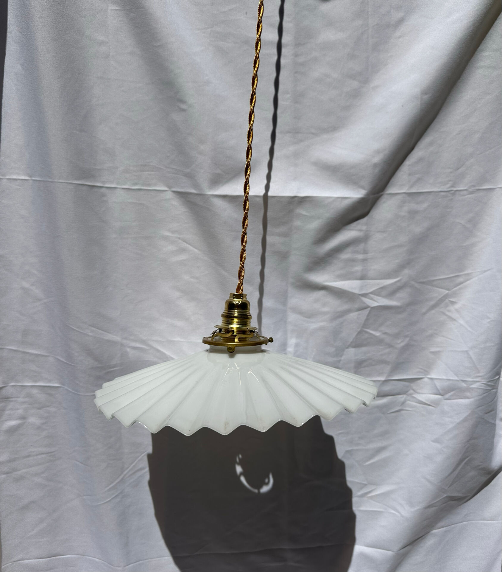 Vintage suspension opaline pleated lampshade with golden threads and claw socket.