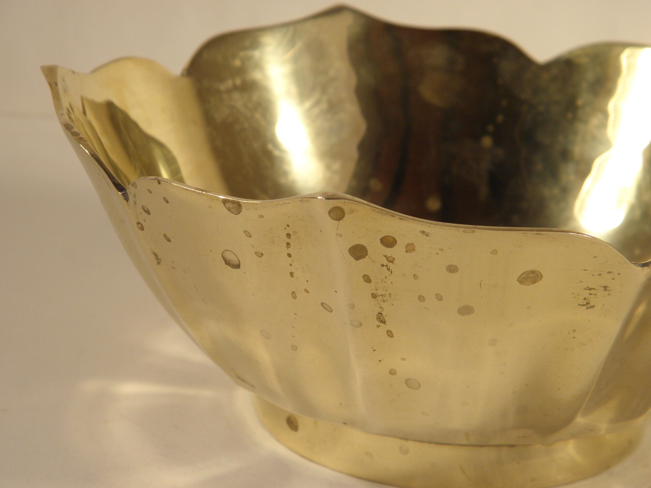 Two brass trundle cups