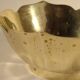 Two brass trundle cups
